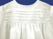 Orarium-collection, Christening gown in silk. Pleated stripes in bodice and in sleeves